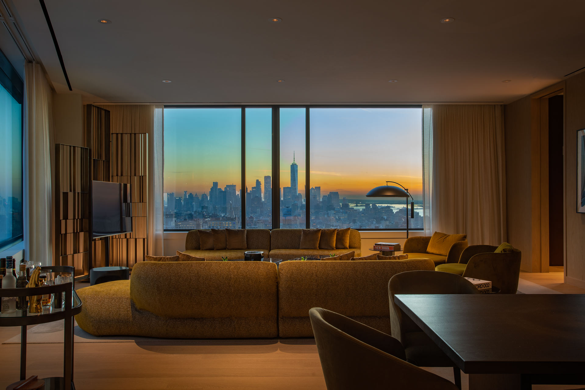 Hotel suite overlooking the Manhattan skyline at sunset